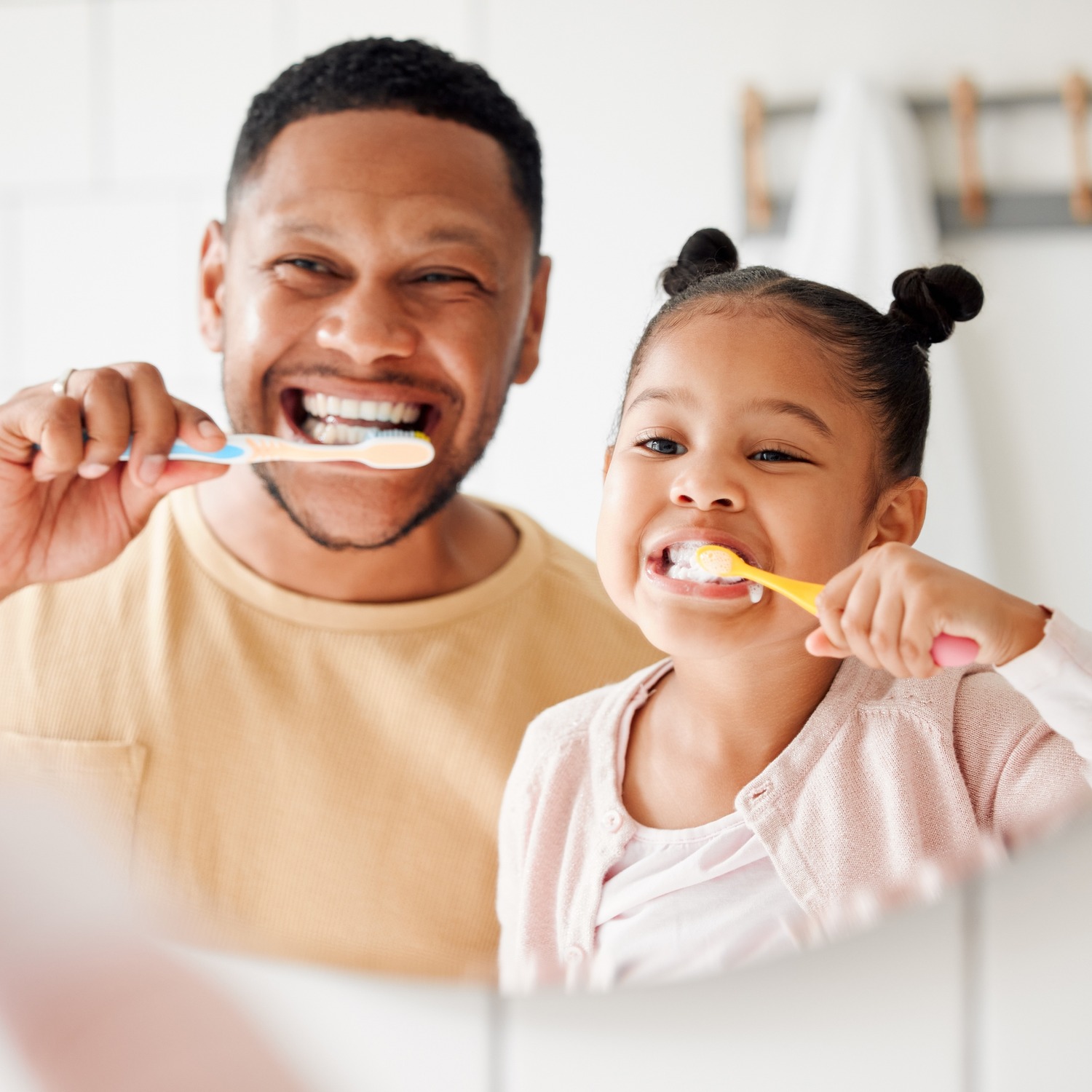 AdobeStock_281626595 v2 Girl showing of her clean teeth at the dentist for a preventive dental appointment in Franklin WI